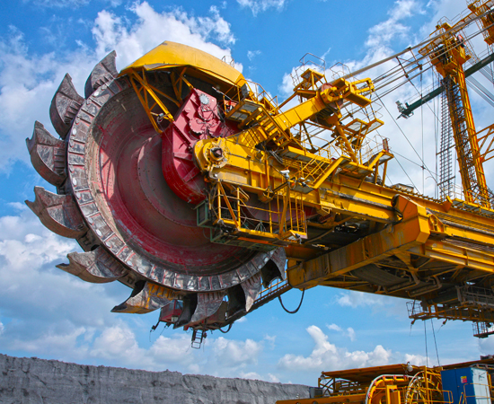 Massive bucket wheel excavator against blue skies